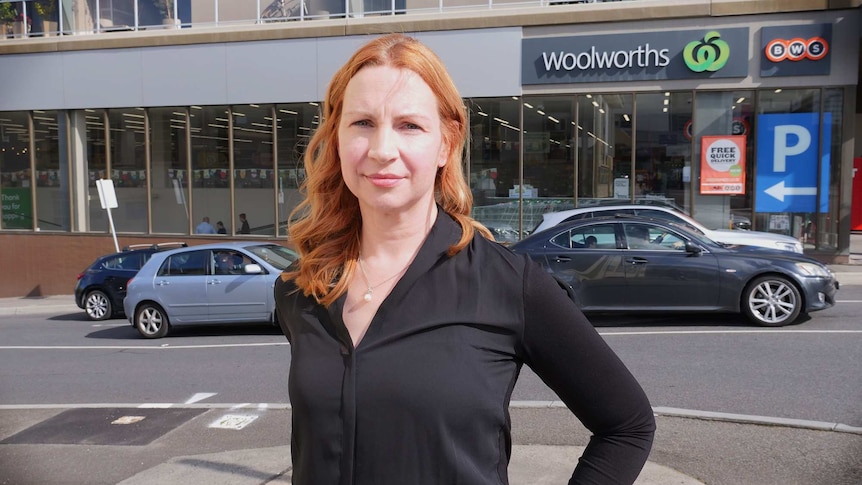 Rebbecca Wilcox poses for a photo outside a Woolworths store in Ivanhoe, Victoria