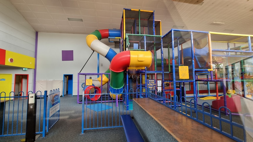 A multi-coloured slippery dip and climbing equipment.