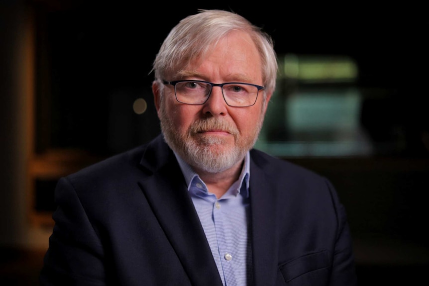 Kevin Rudd dressed in a blue shirt and jacket.