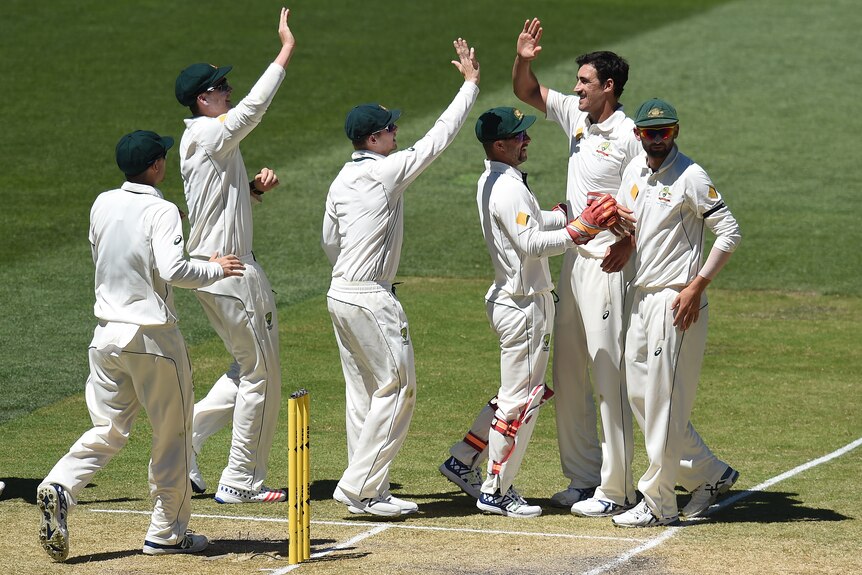 Australian bowler Mitchell Starc reacts after dismissing South Africa's Vernon Philander on day four