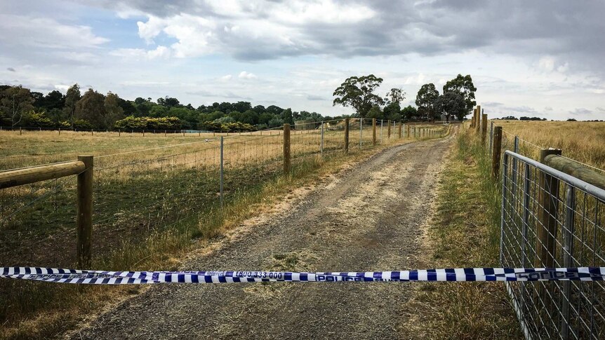 Police tape blocks the driveway of a Kyneton property where a woman was found dead.