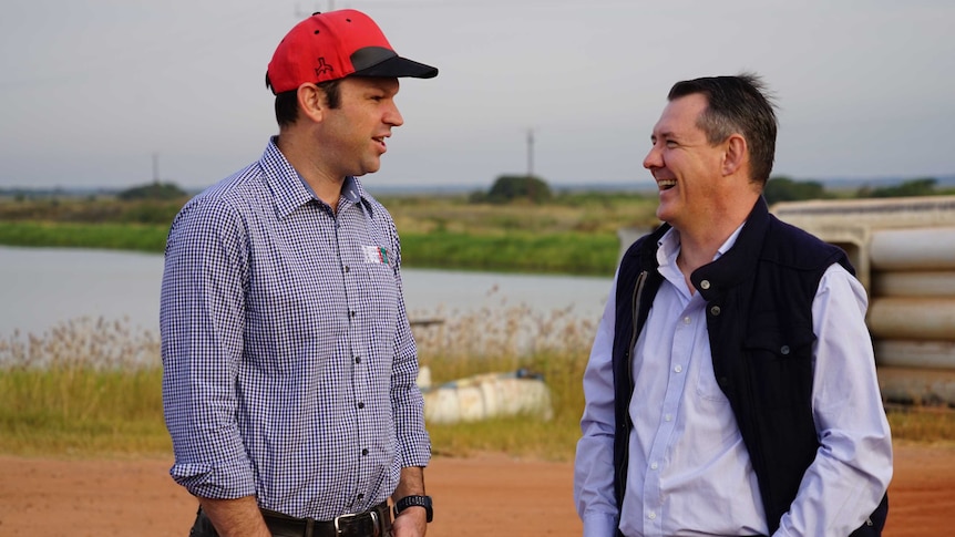 Senator Matt Canavan and Chief Minister Michael Gunner stand by a Barramundi pond.