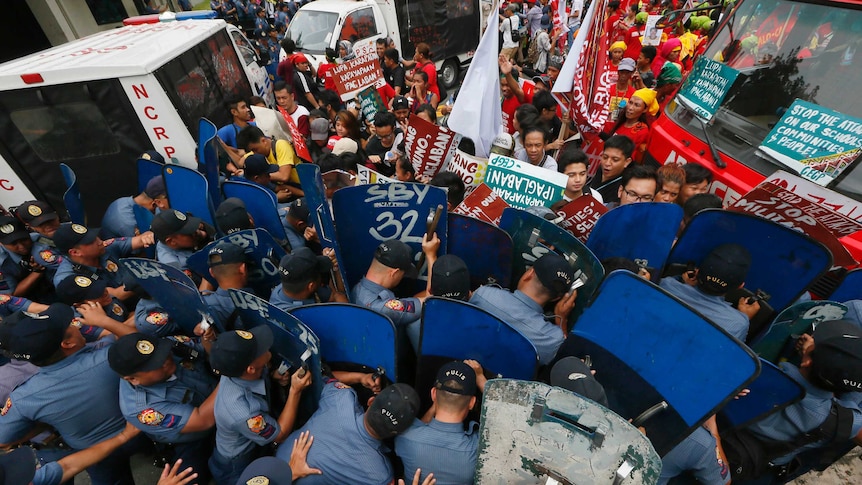Police and protesters clash during a violent protest outside the U.S. Embassy in Manila, Philippines, October 19 2016