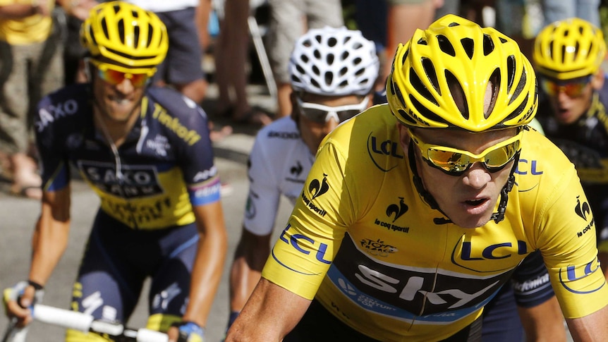 Yellow jersey Chris Froome rides ahead of Spain's Alberto Contador at the 2013 Tour de France.