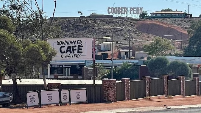 Coober pedy cafe with the hollywood like sign in the background 