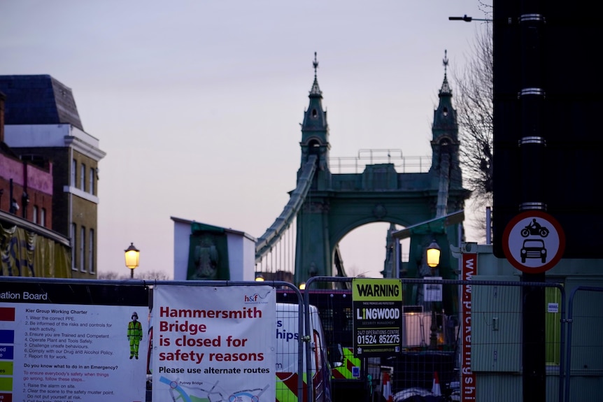 Warning signs in front of Hammersmith  Bridge indicate that it is shut.