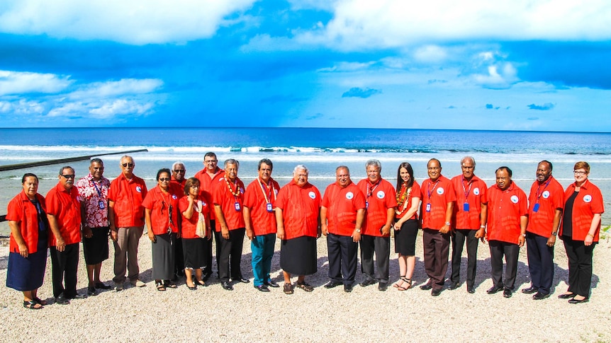 Pacific leaders pose for a photo at the 2018 Pacific Islands Forum, held in Nauru. They are on a beach.