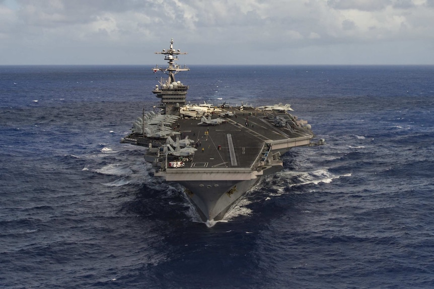 The aircraft carrier USS Carl Vinson transits the Pacific Ocean.