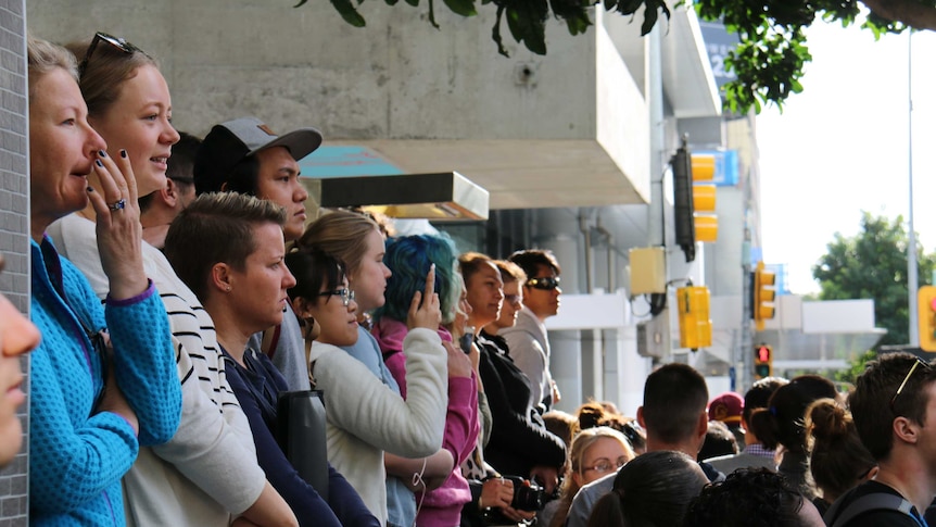 Crowds in Brisbane CBD watch Chris Hemsworth and Tom Hiddleston