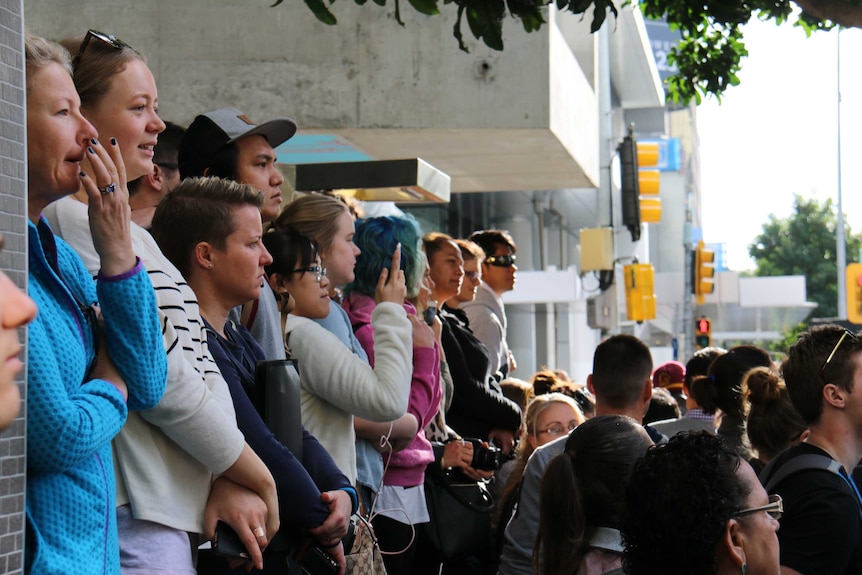 Crowds in Brisbane CBD watch Chris Hemsworth and Tom Hiddleston
