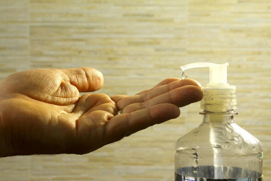 A drop of soap on someones hand