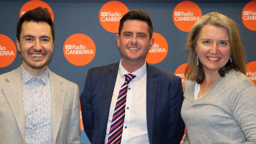 Image of Evatt Primary senior executives Michael Hatswell and Jamal See standing next to ABC Canberra's Adrienne Francis.