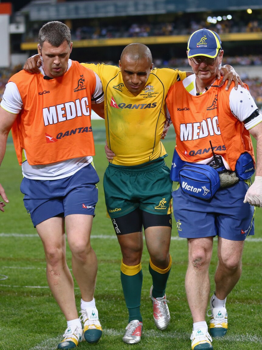 Season over ... Will Genia is helped from the field at Subiaco Oval