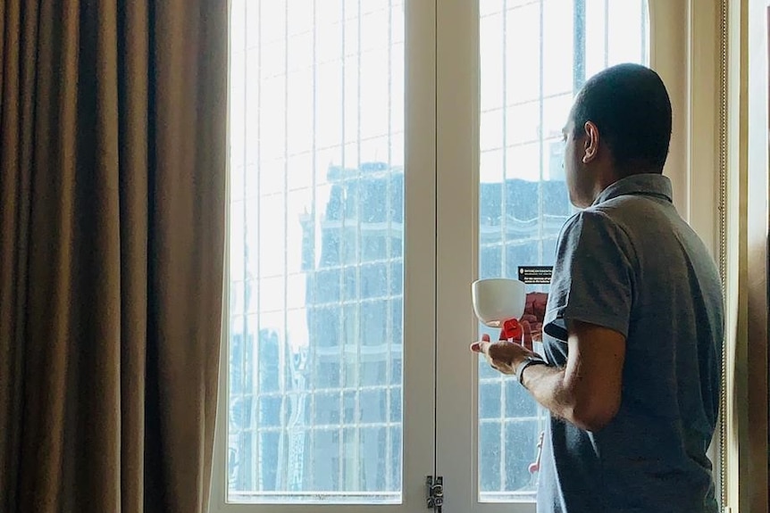 Kaushik Sridhar in quarantine, looking out the hotel window.