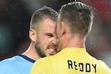 Heated clash ... Matthew Jurman (L) and Liam Reddy square off during the Sydney Derby