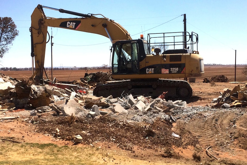 A tractor among rubble on a property hit by the Pinery bushfire