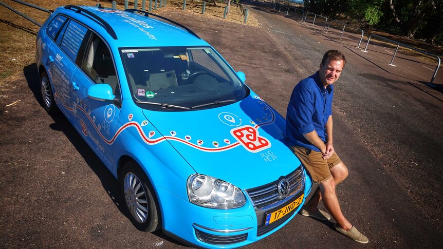 Wiebe Wakker leans on his blue car