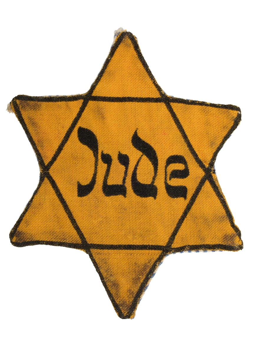A cloth Star of David badge with the word Jude on it.