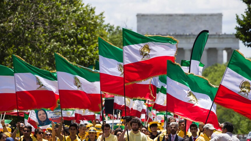 Activists march in Washington D.C. with Shah-era Iranian flags to call for regime change in Iran.