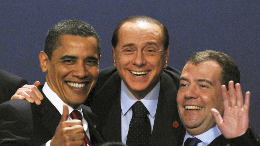 New world order: US President Barack Obama, Italy's PM Silvio Berlusconi and Russia's President Dmitry Medvedev celebrate the G20 deal.