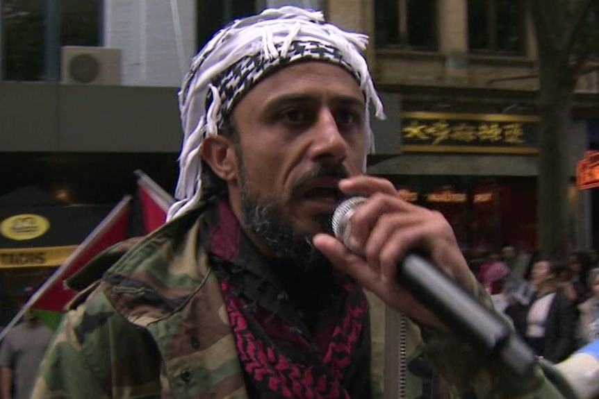 A man speaks at a pro-Palestinian rally in Melbourne's CBD