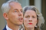 Clare O'Neil stands alongside Andrew Giles at a press conference at parliament house