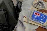 An Australian soldier patrols