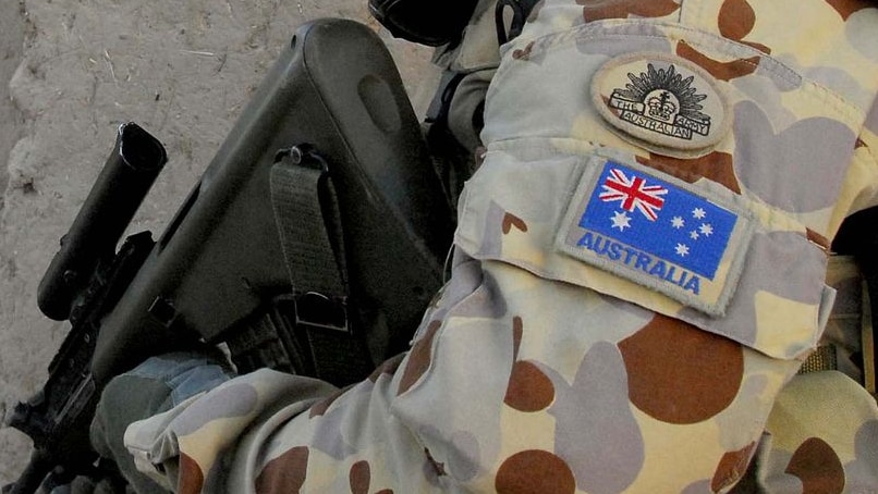 An Australian soldier patrols