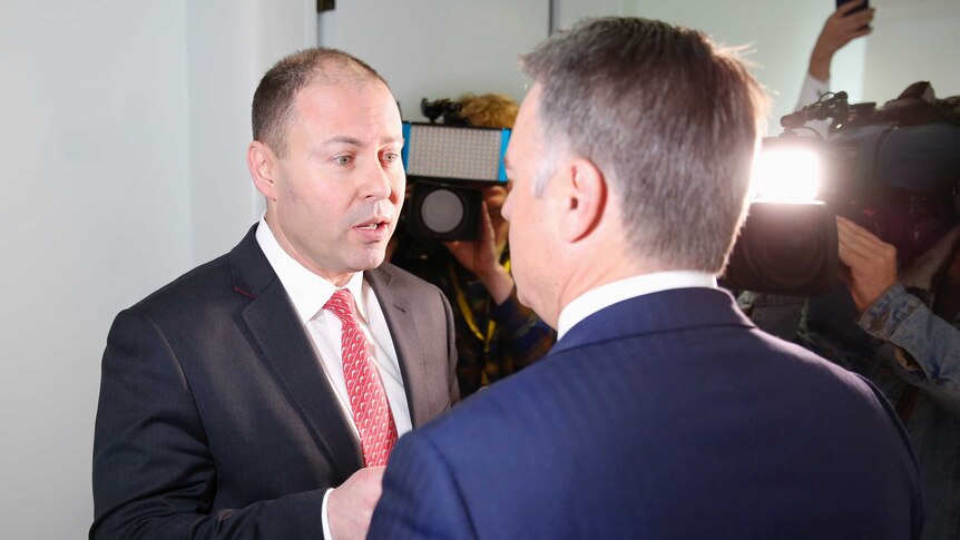 Environment Minister Josh Frydenberg faces off with Labor's Joel Fitzgibbon in front of cameras
