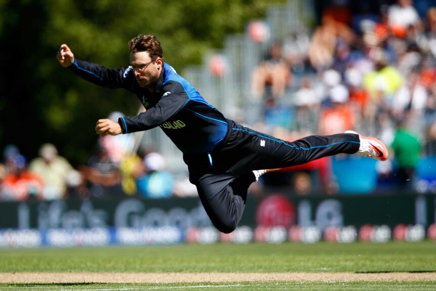 Vettori dives in the field against Scotland