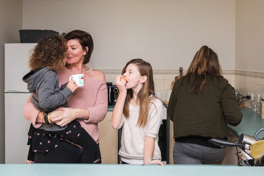 A photo Christielee Plumridge with her daughters in their Camden home to depict the best parts of having children.