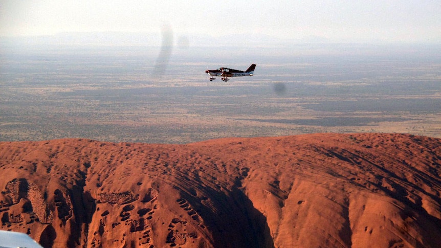 The 1960s Piper Cherokee plane flown by Sam Kidd and Andy Hardy over Uluru in the NT in November 2013.