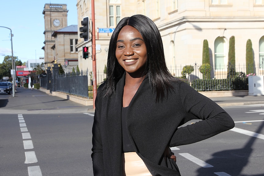 A young woman stands in the centre of the Toowoomba CBD