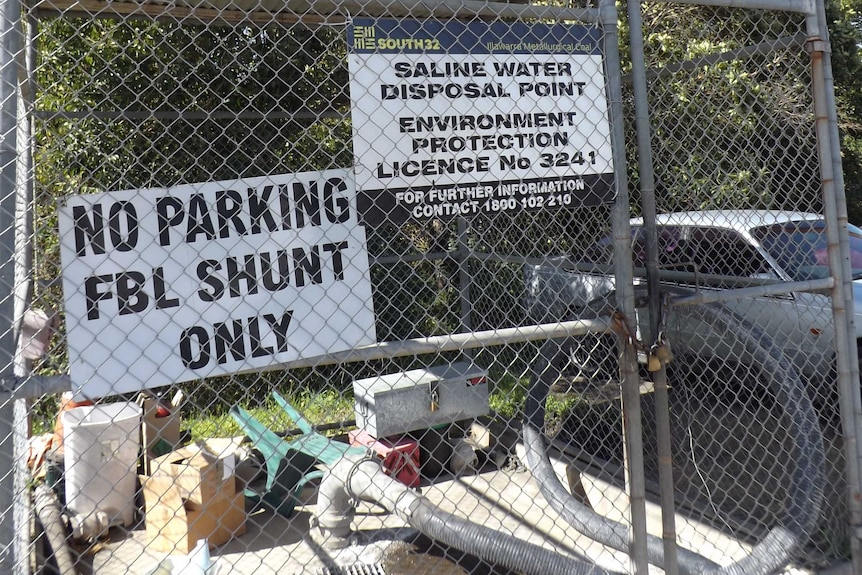 A sign shows the legal operation allowing hundreds of thousand of litres of mine water a day to flow into a creek.