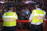 Qld police officers on patrol in schoolies crowds at Surfers Paradise
