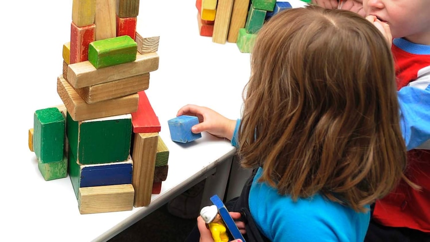 Children play with toys at a preschool