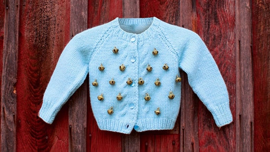 A child's cardigan with bells attached, similar to the one Maude wore.