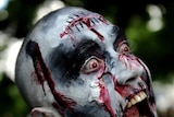 A man dressed as zombie takes part in a zombie walk