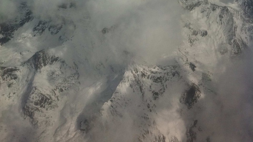 Cloud covers mountains north of Kabul in Afghanistan.