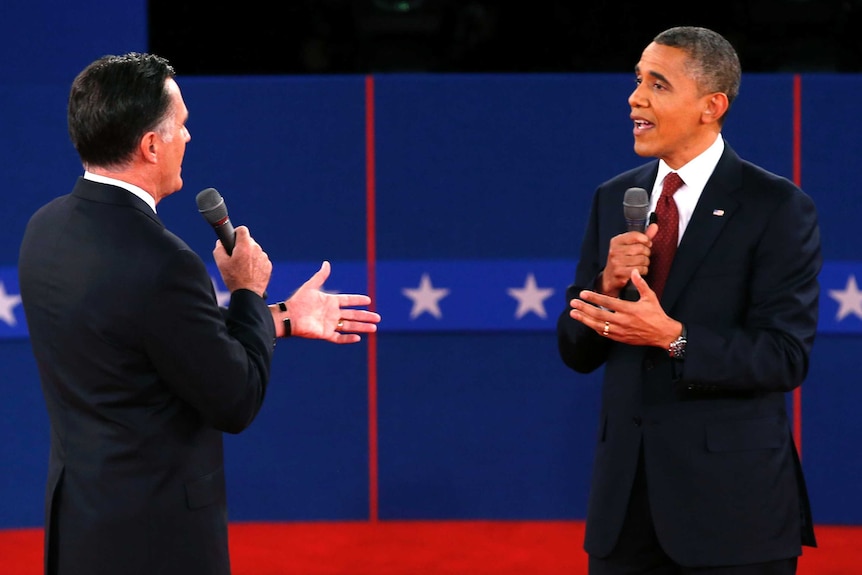 LtoR Mitt Romney and Barack Obama debate on stage.