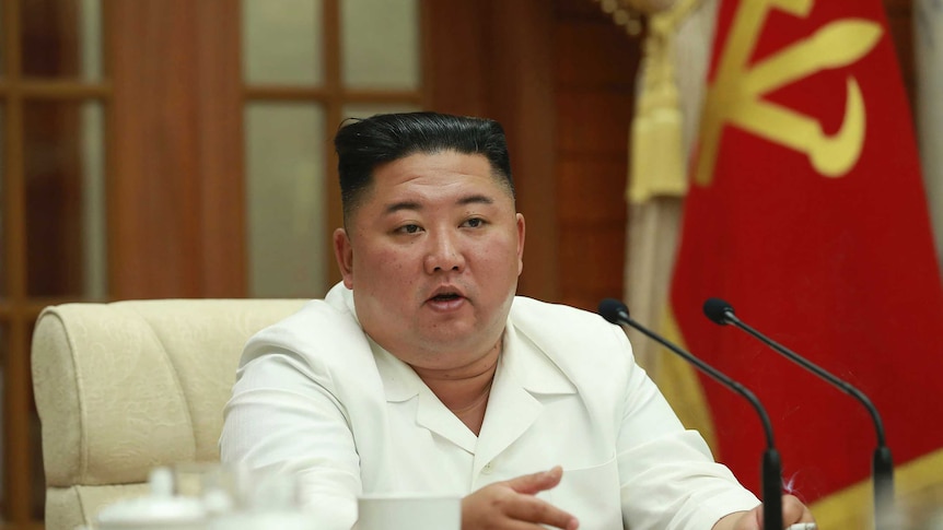 Kim Jong Un speaks during a meeting.