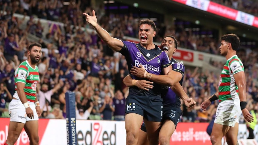 A rugby league player celebrating.