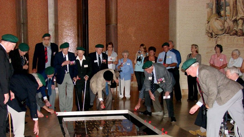 Remembering: members of the 2/5 Independent Squadron lay poppies on the tomb of the Unknown Soldier at the Australian War Memorial.