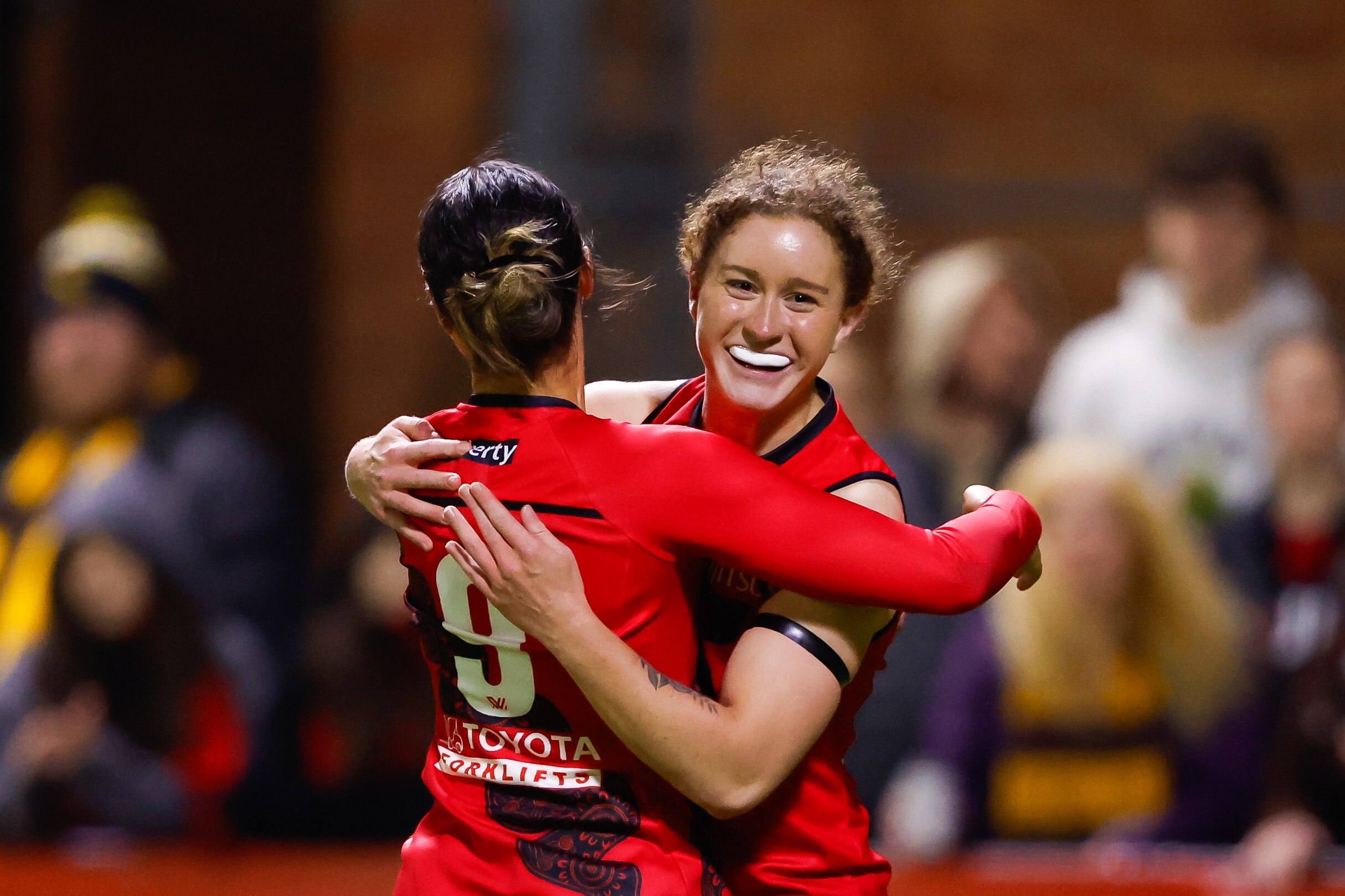 Amber Clarke hugs Brooke Walker