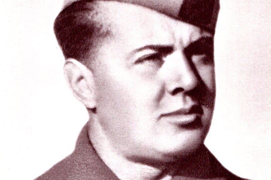 Black and white photo of Enver Hoxha in uniform.