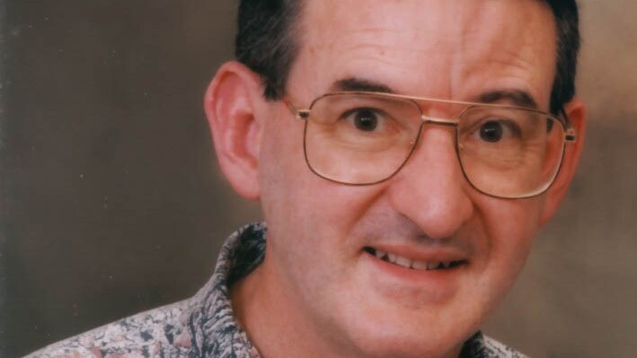 Photo of Ron Smith wearing glasses from when he was younger.