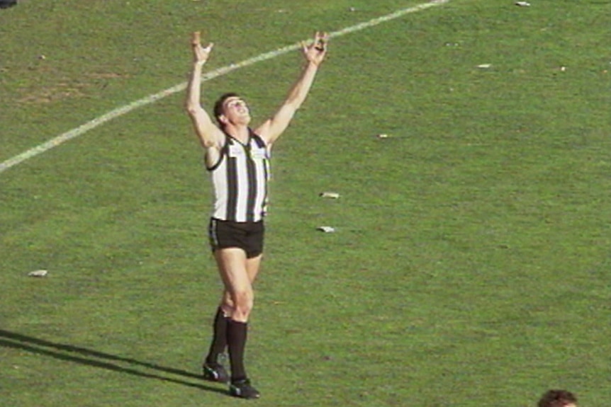 Darren Millane after throwing the ball into the air on the siren of the 1990 AFL grand final.