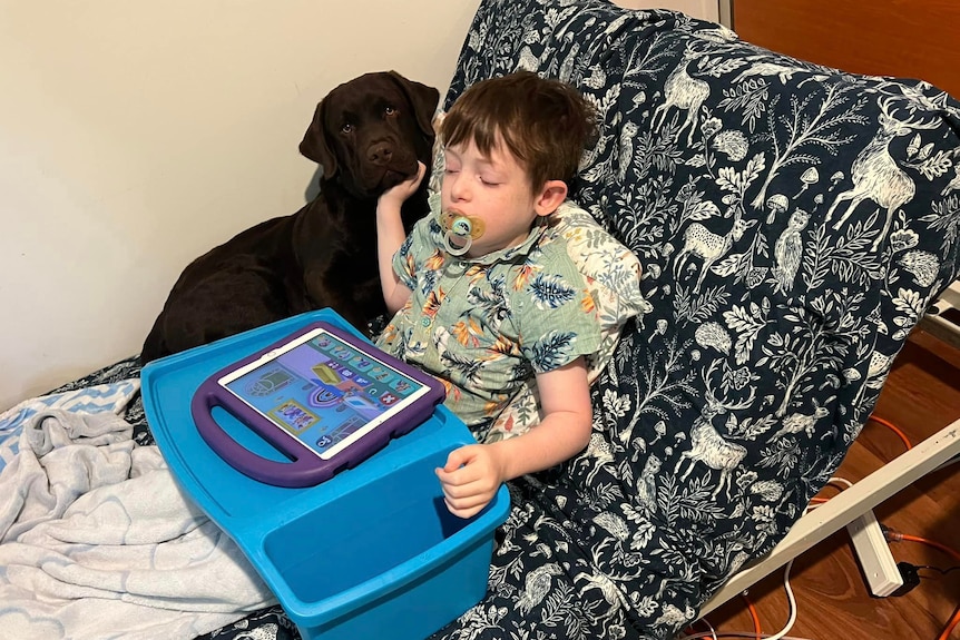 Elton with Charlie who is eating