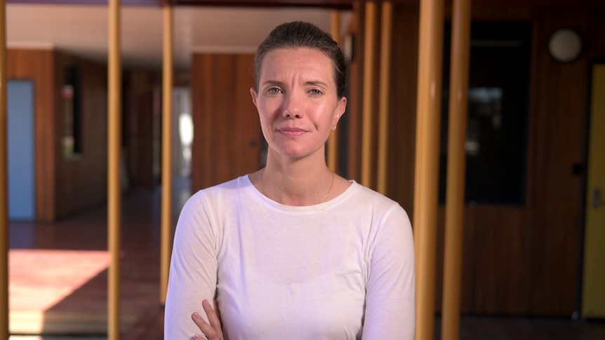 A woman staring grimly at a camera