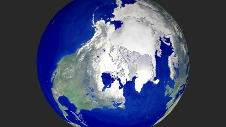 A view from space shows the effect of Arctic ice reflecting light.